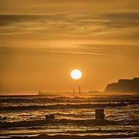 Buy canvas prints of Sunrise over Whitby viewed from Sandsend. by Chris North