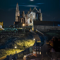 Buy canvas prints of Hunters moon over Saint Hilda's Abbey Whitby, by Chris North