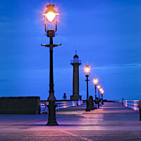 Buy canvas prints of Pier Lights at dusk, Whitby. by Chris North