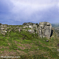 Buy canvas prints of The Cow and Calf rocks and Ilkley town. by Chris North