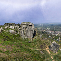 Buy canvas prints of The Cow and Calf rocks and Ilkley town. by Chris North