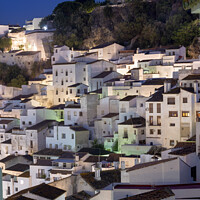 Buy canvas prints of The white mountain village of Casares. by Chris North