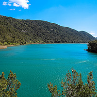 Buy canvas prints of Emerald lake running through Krka National Park Cr by  