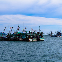 Buy canvas prints of Fishing boats at sea in Thailand by  