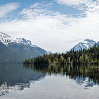 Buy canvas prints of Lake McDonald with Forest and Mountain Reflections by Janet Mann