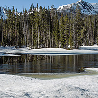 Buy canvas prints of Frozen River High in Rockies by Janet Mann