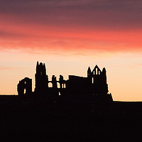 Buy canvas prints of Sunrise behind Whitby Abbey  by Janet Mann