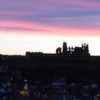 Buy canvas prints of Sunrise behind Whitby famous for Dracula Stories by Janet Mann