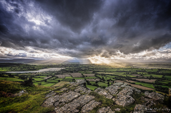 Sun's rays over the Brecon Beacons Picture Board by Karl McCarthy