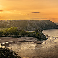 Buy canvas prints of Golden Sunrise at Three Cliffs Bay by Karl McCarthy