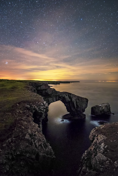 Green Bridge under distant lights Picture Board by Karl McCarthy