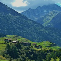 Buy canvas prints of Village nestled in the Swiss Alps. by Joanne Court