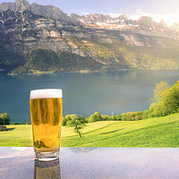Buy canvas prints of Glass of beer in a summer alpine scenery by Daniela Simona Temneanu