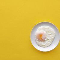 Buy canvas prints of Fried egg in a plate on a yellow background by Daniela Simona Temneanu