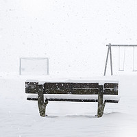 Buy canvas prints of Playground and bench covered by snow by Daniela Simona Temneanu