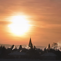 Buy canvas prints of Colorful winter sunrise over village by Daniela Simona Temneanu