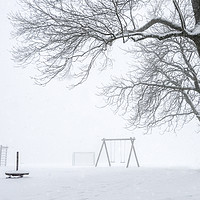 Buy canvas prints of Snowstorm over an empty playground by Daniela Simona Temneanu