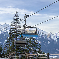 Buy canvas prints of Ski lift with the snowy mountain in the background by Daniela Simona Temneanu