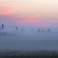 Buy canvas prints of Church tower and village in fog at dawn by Daniela Simona Temneanu