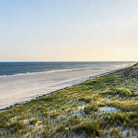 Buy canvas prints of Beach landscape at sunrise on Sylt island. Empty beach at North sea by Daniela Simona Temneanu