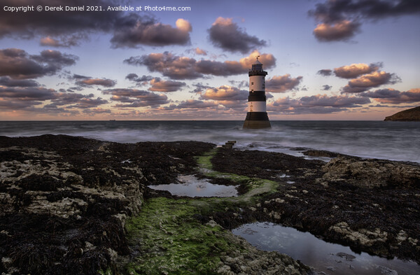 Dramatic Sunset Over Trwyn Du Lighthouse Picture Board by Derek Daniel