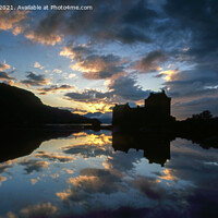 Buy canvas prints of Majestic Sunset at Eilean Donan Castle by Derek Daniel