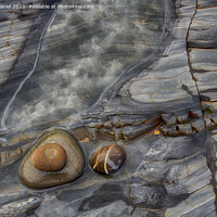 Buy canvas prints of Rocks on the beach at Sandymouth by Derek Daniel