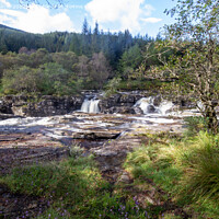 Buy canvas prints of The fast flowing river through Glen Orchy by Derek Daniel