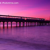 Buy canvas prints of Sunrise at Boscombe Pier #4 (panoramic) by Derek Daniel