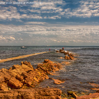 Buy canvas prints of Fishing on the rocks at Peveril Point, Swanage by Derek Daniel