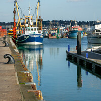 Buy canvas prints of Fishing Boats at Poole Quay by Derek Daniel