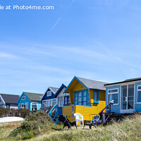 Buy canvas prints of Beach Huts at Hengistbury Head (panoramic) by Derek Daniel