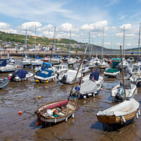 Buy canvas prints of Boats Dancing on the Outgoing Tide by Derek Daniel