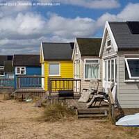 Buy canvas prints of The Colourful Beach Huts at Hengistbury Head by Derek Daniel