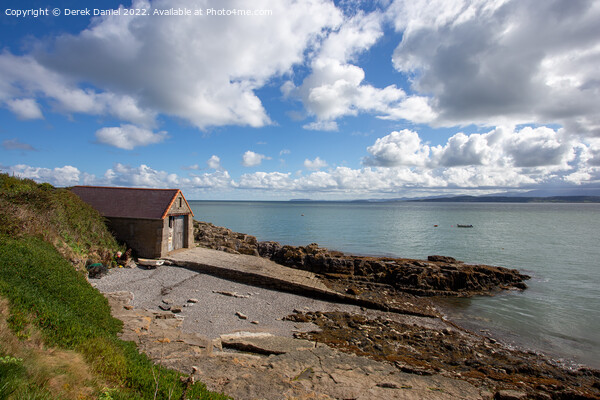 Slipway along the coast at Moelfre Picture Board by Derek Daniel