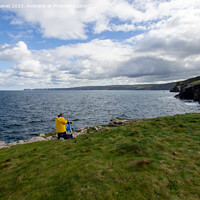 Buy canvas prints of A Serene Fishing Spot on Cornwalls Rugged Headland by Derek Daniel