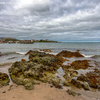 Buy canvas prints of Rocky Beach at Cemaes Bay, Anglesey by Derek Daniel