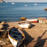 Buy canvas prints of boats on the slipway at Swanage by Derek Daniel