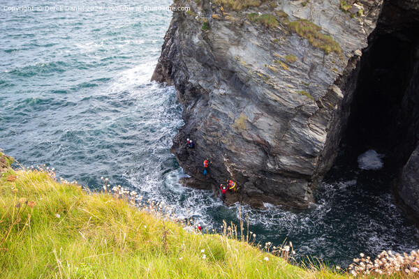 Coasterring around the cliffs at Port Gaverne Picture Board by Derek Daniel