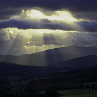 Buy canvas prints of Pitlochry- Light beams on the hills by Derek Daniel