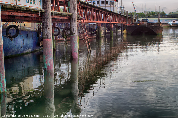 Rusty Reflections on Southampton Boat Berth Picture Board by Derek Daniel