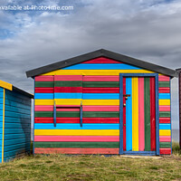 Buy canvas prints of Colourful beach huts at Hopeman by Derek Daniel