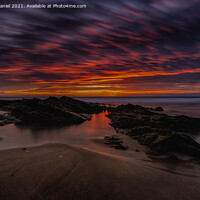 Buy canvas prints of Fiery Red Sunset at Crooklets Beach, Bude by Derek Daniel