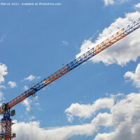 Buy canvas prints of An arrow of a tower crane against a blue sky, divides the image diagonally. by Sergii Petruk