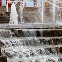 Buy canvas prints of Running water through a cascading stepped fountain. by Sergii Petruk