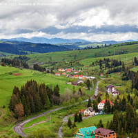 Buy canvas prints of A picturesque landscape of a Carpathian village with a winding road and colorful roofs in early spring. by Sergii Petruk