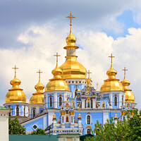 Buy canvas prints of Golden domes of St. Michael's Golden-Domed Cathedral in Kiev in the spring against a blue cloudy sky on a warm spring day. by Sergii Petruk