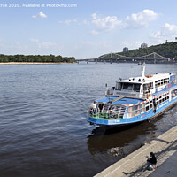 Buy canvas prints of Pleasure boat moored at the city wharf of the Dnipro River by Sergii Petruk