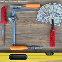 Buy canvas prints of Old construction tools and a set of dollar bills on a wooden table close-up by Sergii Petruk