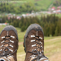 Buy canvas prints of Mountain trekking boots close-up after a long journey through the mountains by Sergii Petruk